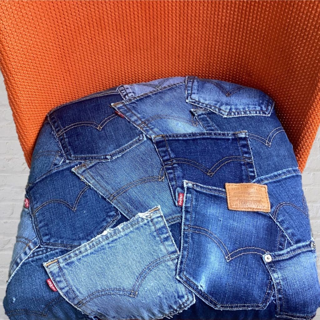Vintage Levi's iconic Chair | Lloyd Loom Upholstered in Levi's denim Jeans pockets