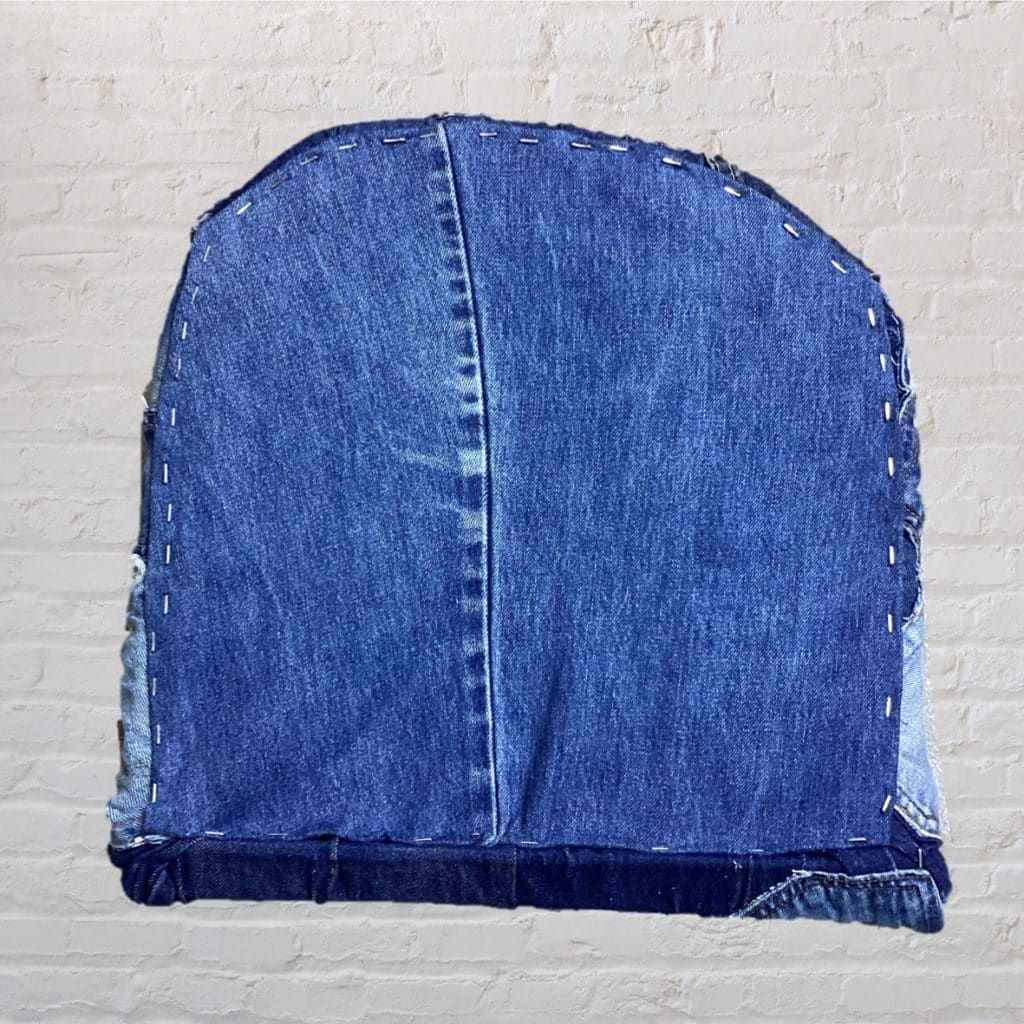 Vintage Levi's iconic Chair | Lloyd Loom Upholstered in Levi's denim Jeans pockets